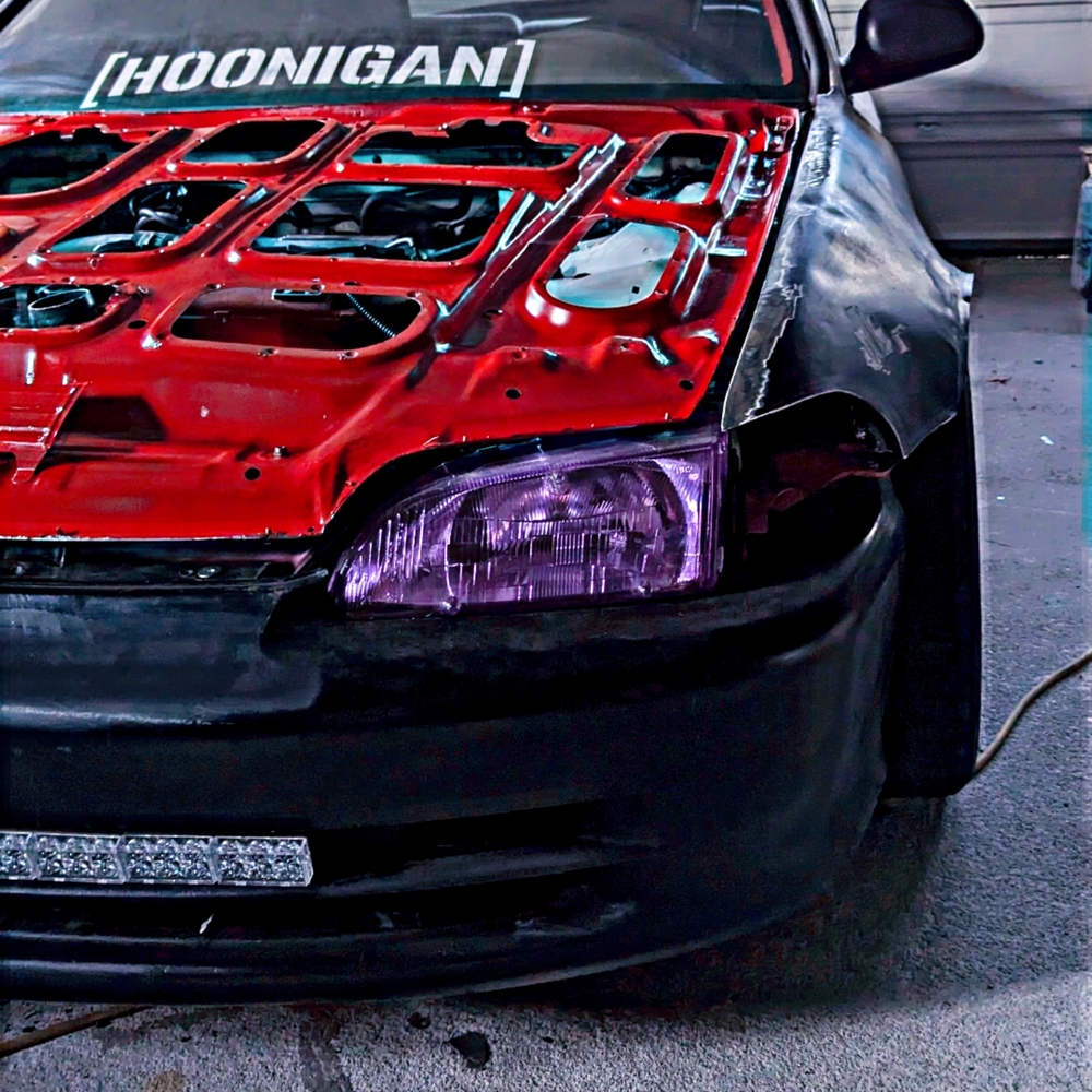 Red and Black Modified Car Front with Branding